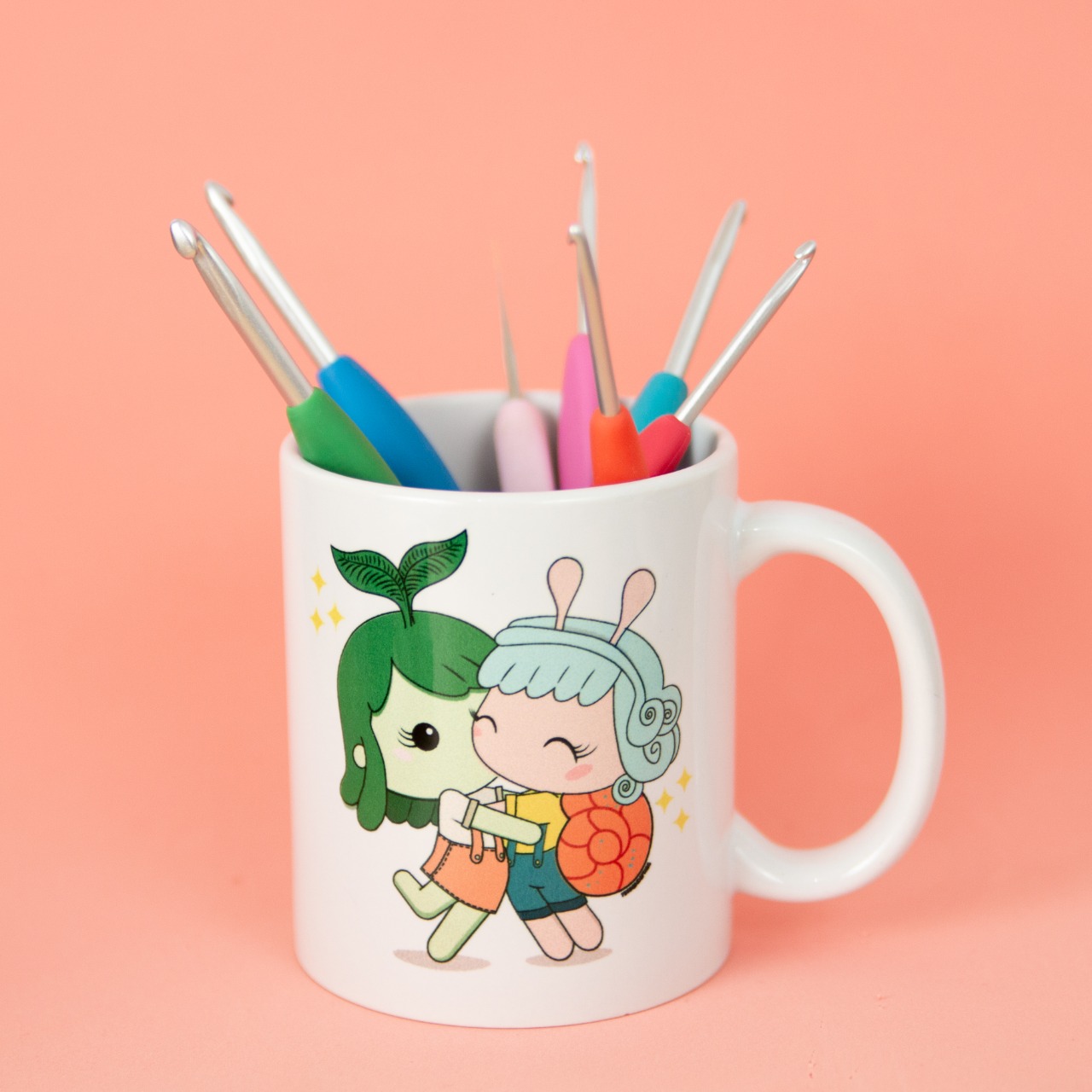 Nome do produto: Caneca Flora e Cora (Bia Moraes e Fernanda Frias)